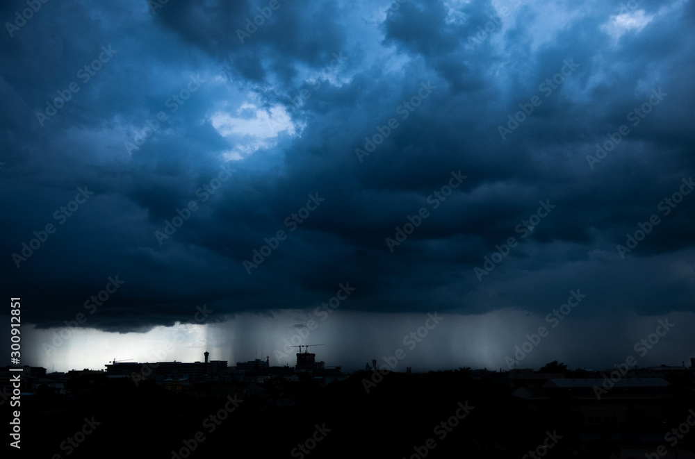 Storm cloud with heavy rain, lightning over city Storm cloud with heavy rain, lightning over city
