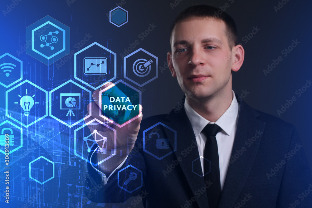 Obraz premium Business, Technology, Internet and network concept. Young businessman working on a virtual screen of the future and sees the inscription: Data privacy