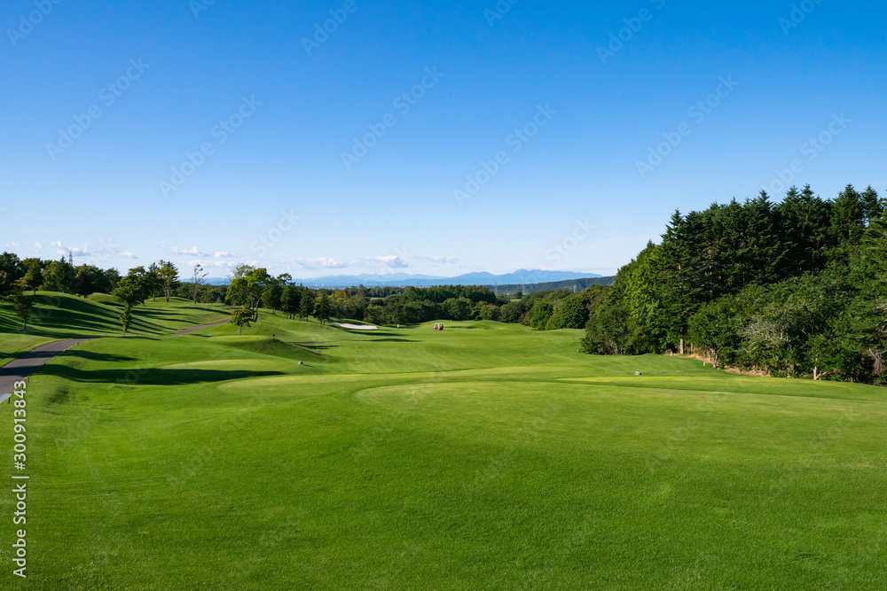 View of Golf Course with teeing area. Golf course with a rich green turf beautiful scenery.
