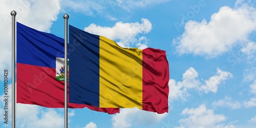 Bild auf Leinwand Haiti and Chad flag waving in the wind against white cloudy blue sky together