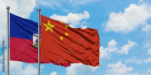 Εκτύπωση καμβά Haiti and China flag waving in the wind against white cloudy blue sky together