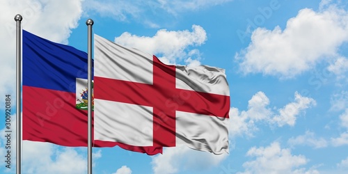 Εκτύπωση καμβά Haiti and England flag waving in the wind against white cloudy blue sky together