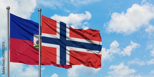 Εκτύπωση καμβά Haiti and Norway flag waving in the wind against white cloudy blue sky together