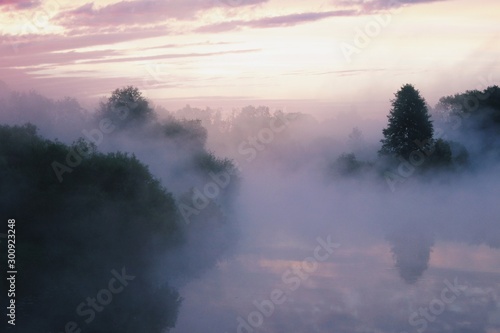 Fog over river at sunrise