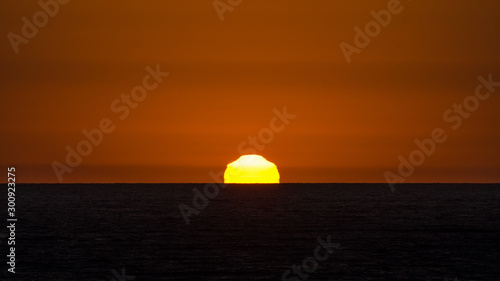 Sunset over the ocean © Joern