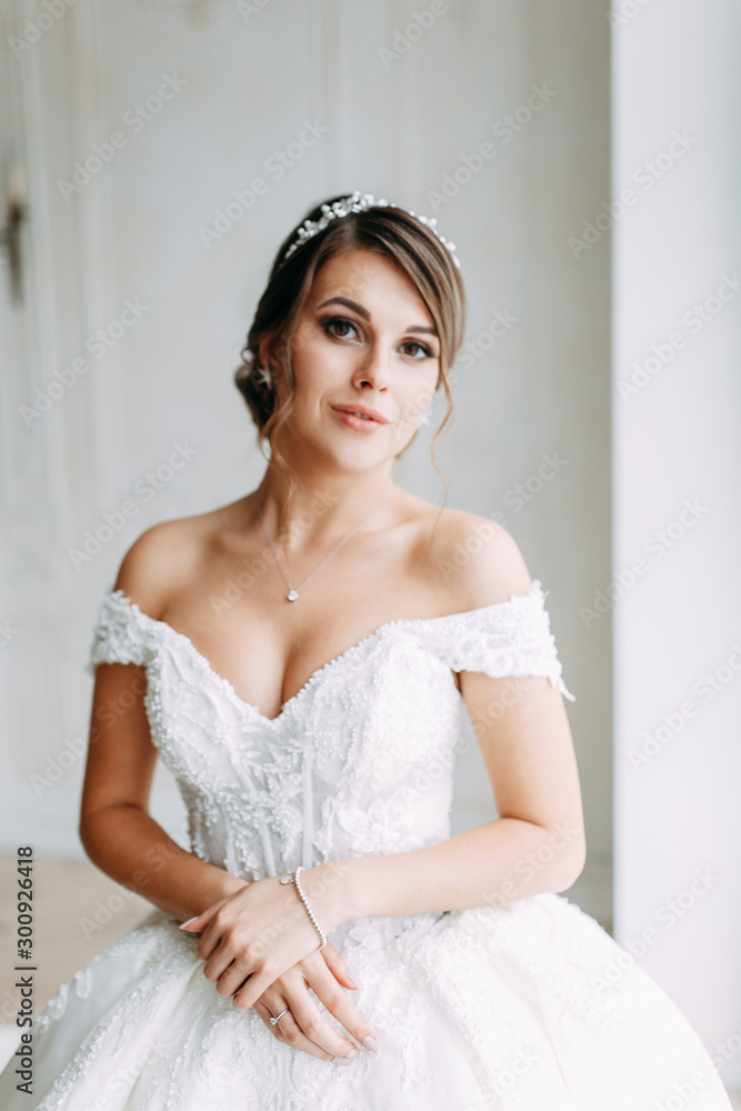 Stylish European style wedding in the hallway. Happy bride at the hotel. Stylish European style wedding in the hallway. Happy bride at the hotel.