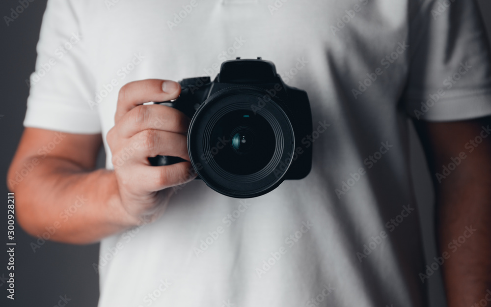 Photographer holding a digital camera