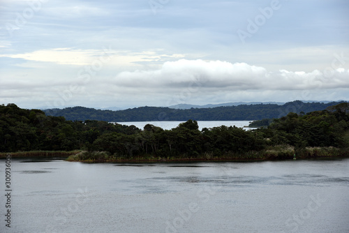 Fototapeta Naklejka Na Ścianę i Meble -  Landscape of the Panama Canal (islands on the Gatun Lake) view from the transiting cargo ship.