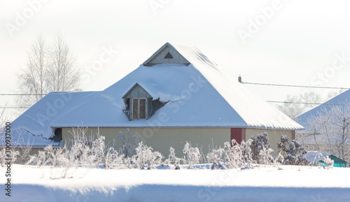 House with snow on the roof © schankz