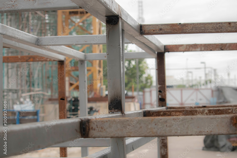 Gray steel frame for making outdoor shelving in building construction area
