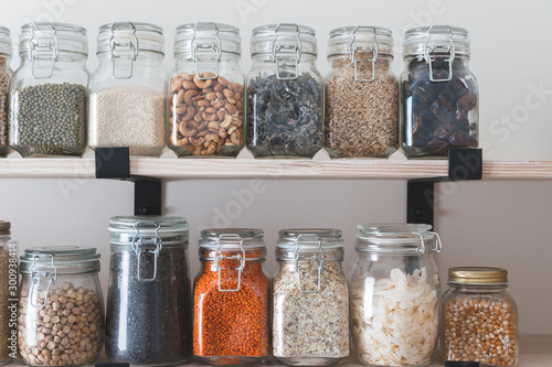 shelves with glass jars filled with groceries