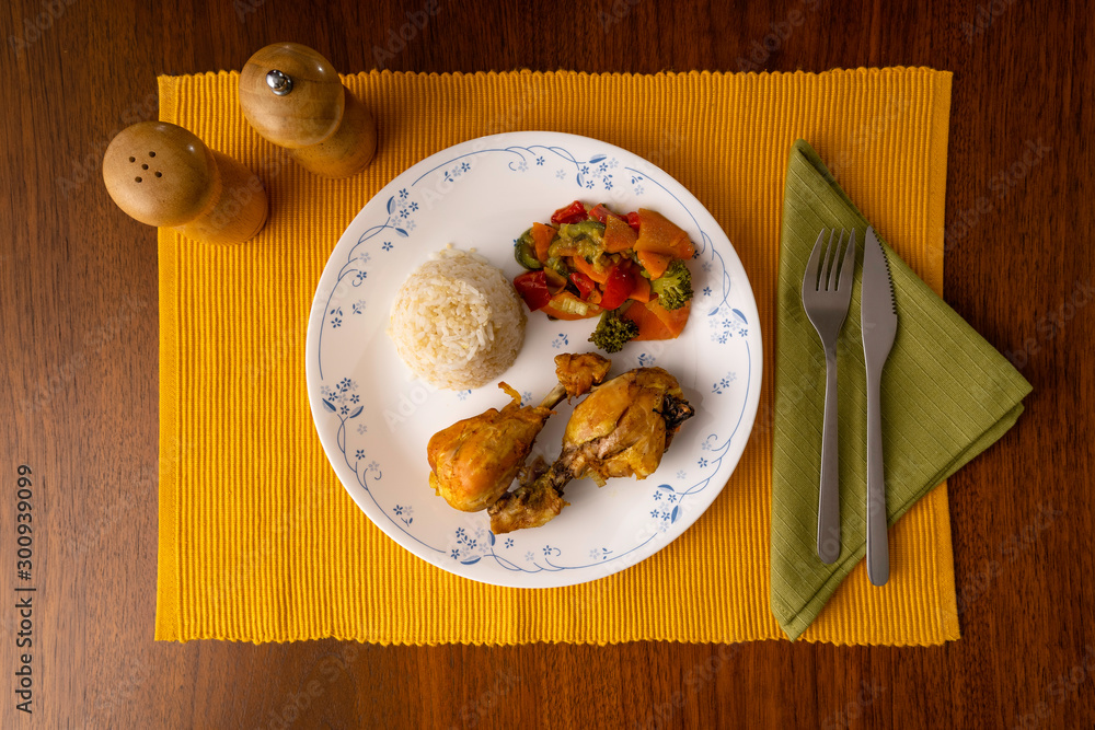 boiled chicken with curry, served with rice mixed with quinoa and boiled vegetables boiled chicken with curry, served with rice mixed with quinoa and boiled vegetables