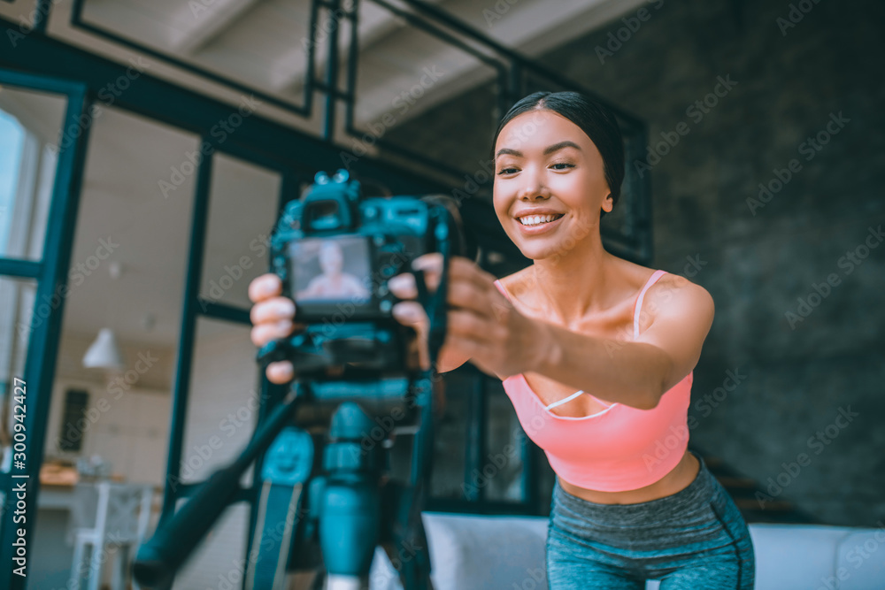 Fototapeta premium Blogger using modern equipment for making video