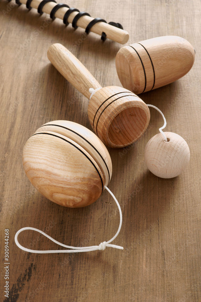 Vintage wooden toys including a yoyo spinning top and cup and ball Stock  Photo | Adobe Stock