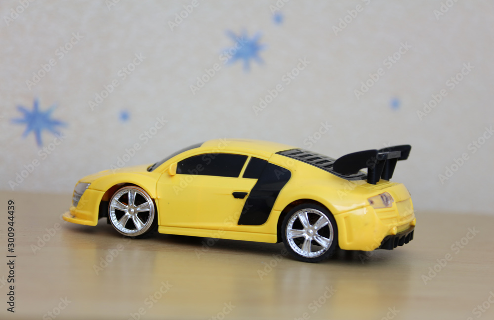 single isolated yellow plastic car toy