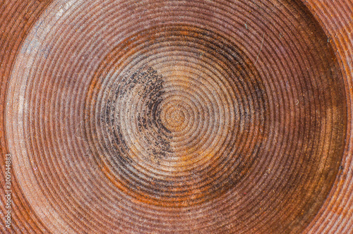 Cast-iron pancake of enameled kitchen electric stove close-up, macro shot. Dirt stuck in the ribs, corrosion of old heating elements.