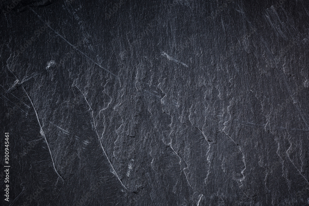 Naklejka premium Dark grey and black slate background or texture