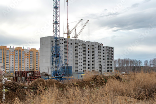 Fotografie construction cranes on the construction site new residential area