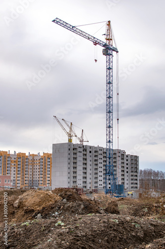 Konstfotografi construction cranes on the construction site new residential area