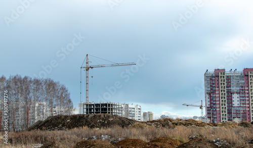 Fotografie construction cranes on the construction site new residential area