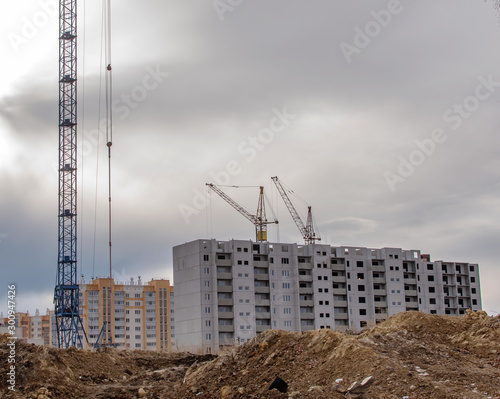 Konstfotografi construction cranes on the construction site new residential area