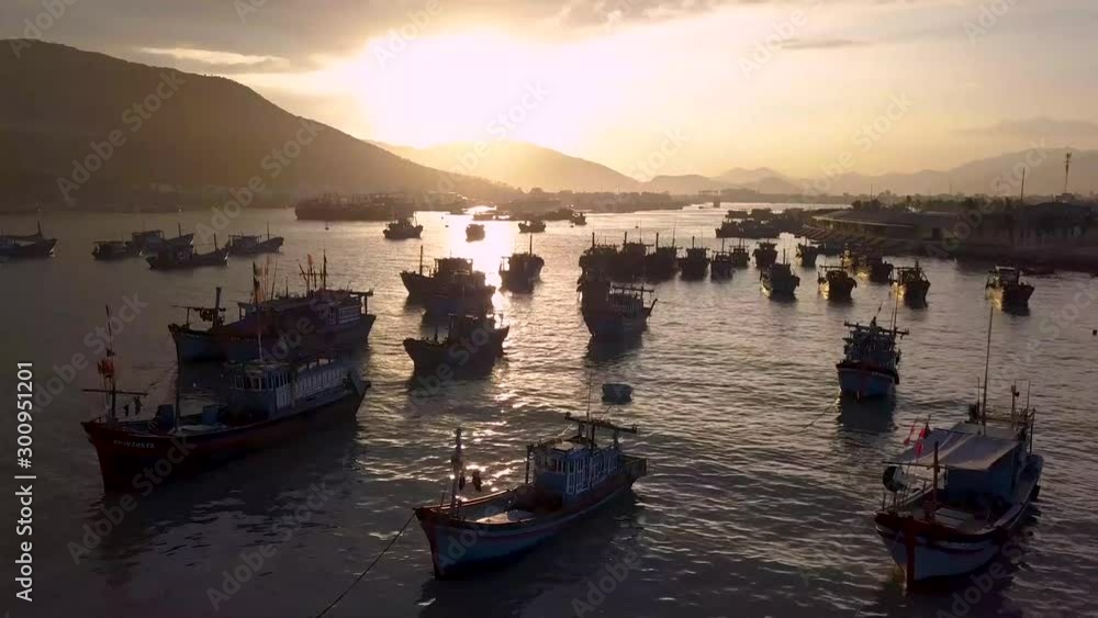 Drone shoots video of fisherman boat sunset and mountain view Drone shoots video of fisherman boat sunset and mountain view