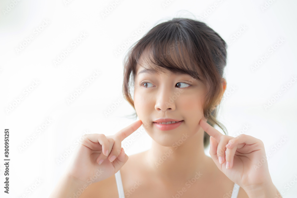 Portrait beautiful asian woman makeup of cosmetic, girl hand touch cheek and smile attractive, face beauty perfect with wellness in the bedroom at home with skin care and healthcare concept. Portrait beautiful asian woman makeup of cosmetic, girl hand touch cheek and smile attractive, face beauty perfect with wellness in the bedroom at home with skin care and healthcare concept.
