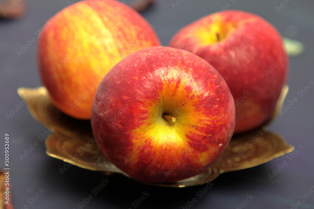 A tray with apples on a wooden background A tray with apples on a wooden background