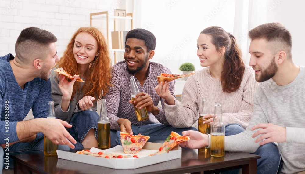 Best friends celebrating meeting, drinking beer and eating pizza Best friends celebrating meeting, drinking beer and eating pizza