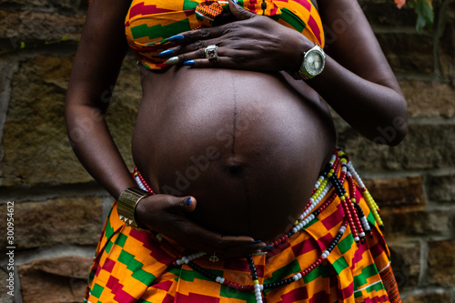 woman holding pregnant belly