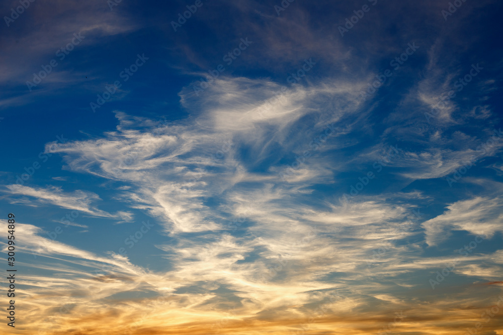Beautiful blue sky with white clouds in sunset or sunrice time nature background. Cloudscape in light day