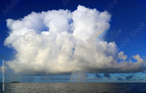Rainbow and white lush cloud over the Indian Ocean, Maldives