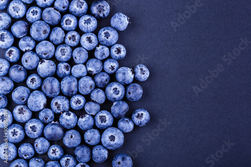 Top view photography blueberries stack on black background. Copyspace for your text design