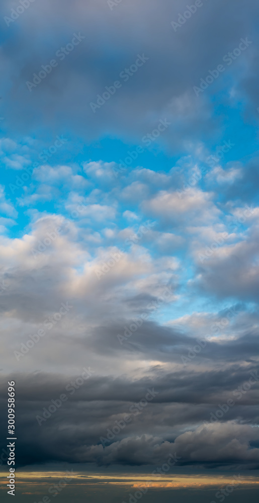 Fantastic clouds against blue sky, panorama