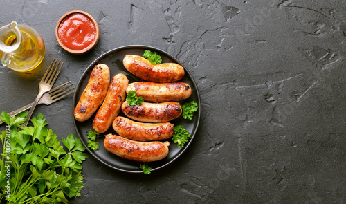 Barbecue sausage with fresh parsley photo