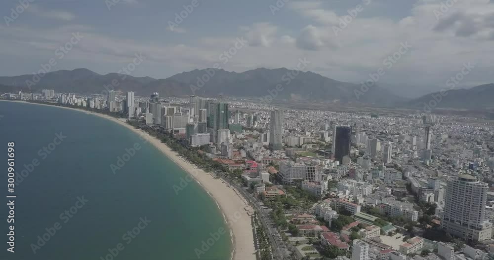 a flying camera flies over the city of Nha trang, in Vietnam, from a great height a beautiful panorama opens overlooking the river, the sea and the mountains a flying camera flies over the city of Nha trang, in Vietnam, from a great height a beautiful panorama opens overlooking the river, the sea and the mountains