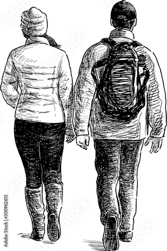 A sketch of couple  city dwellers walking along  street in cold weather