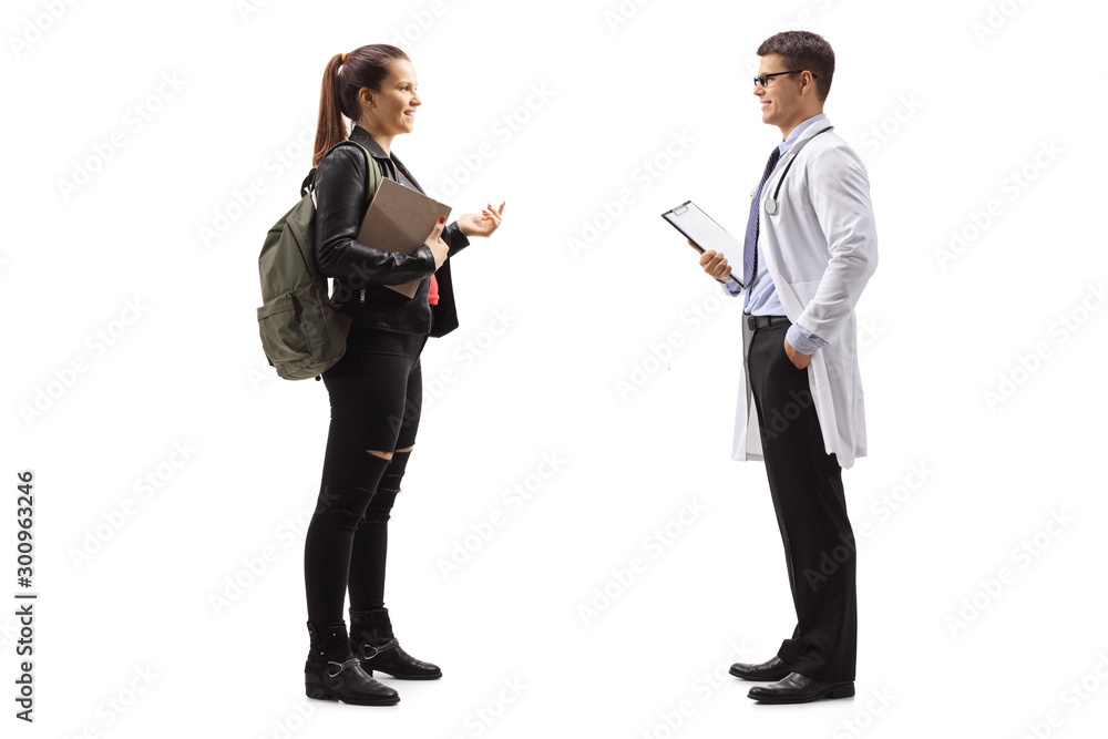 Female teenager talking to a male doctor Female teenager talking to a male doctor