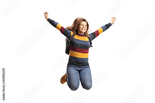 Happy female student jumping