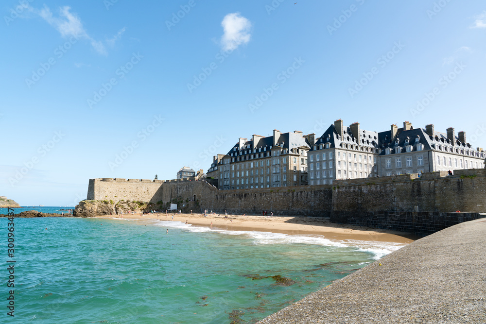 view of the historic old town of Saint-Malo with beach and coast at low tide