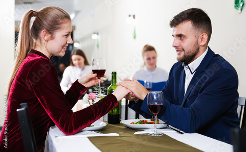 Gentleman with elegant woman are having dinner in luxury restaurante