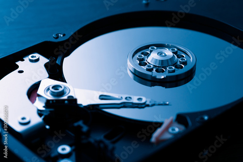 Hard drive close up. Blue tinted. Disassembled PC hard drive.