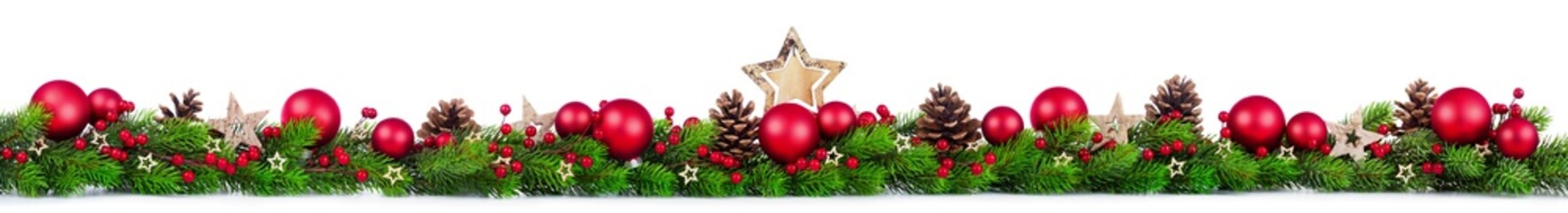 Extra wide Christmas border with fir branches, red and silver baubles, pine cones and other ornaments, isolated on white
