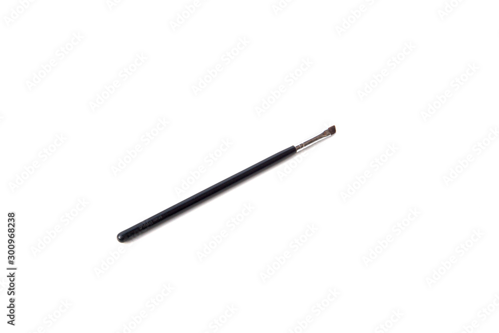 Black handle thin make up brush on white background.