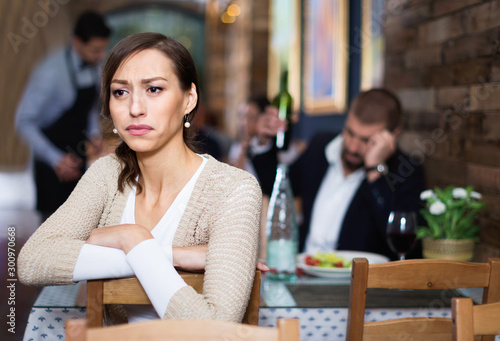 Portrait of upset man and woman in the restaurant on meeting © JackF