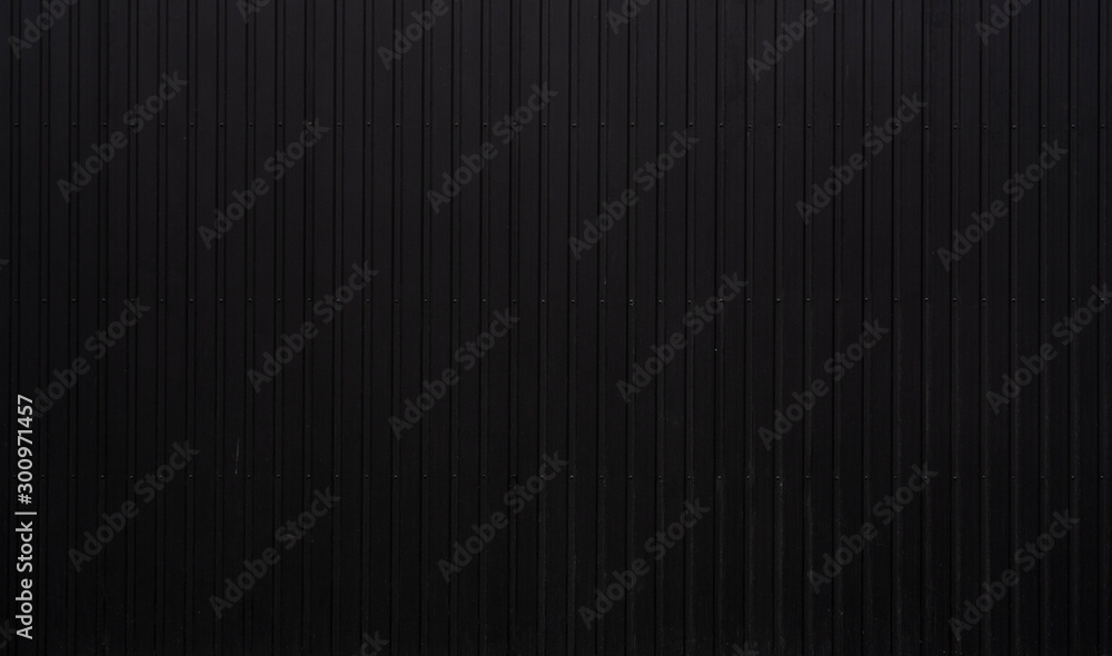 Black Corrugated metal sheet texture surface of the wall. Galvanize steel background. Black Corrugated metal sheet texture surface of the wall. Galvanize steel background.