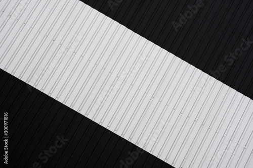 Black and white Corrugated metal sheet texture surface of the wall. Galvanize steel background.