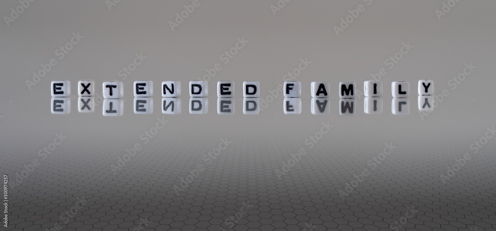 The concept of extended family represented by black and white plastic letter cubes The concept of extended family represented by black and white plastic letter cubes