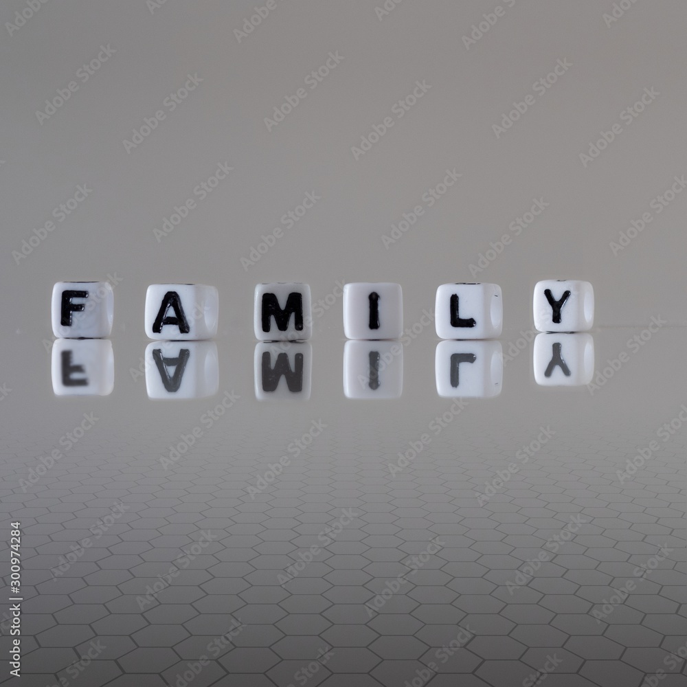 The concept of family represented by wooden letter tiles The concept of family represented by wooden letter tiles