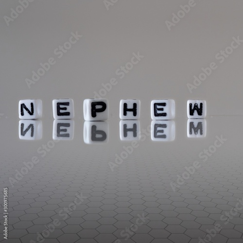 The concept of nephew represented by wooden letter tiles photo